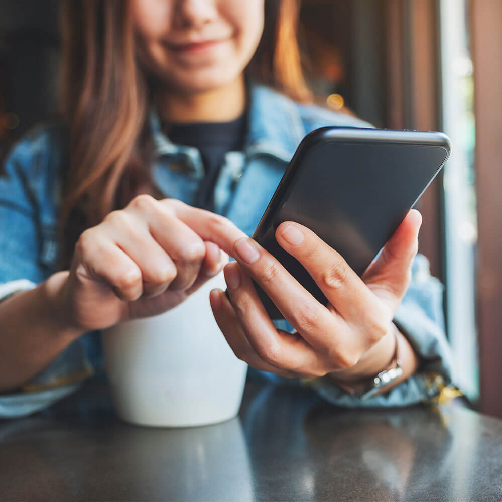 Go to market strategy image - coffee and on mobile device Go to market strategy image - coffee and on mobile device